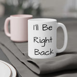 I'll Be Right Back Ceramic Mug Right view on a grey tablecloth.